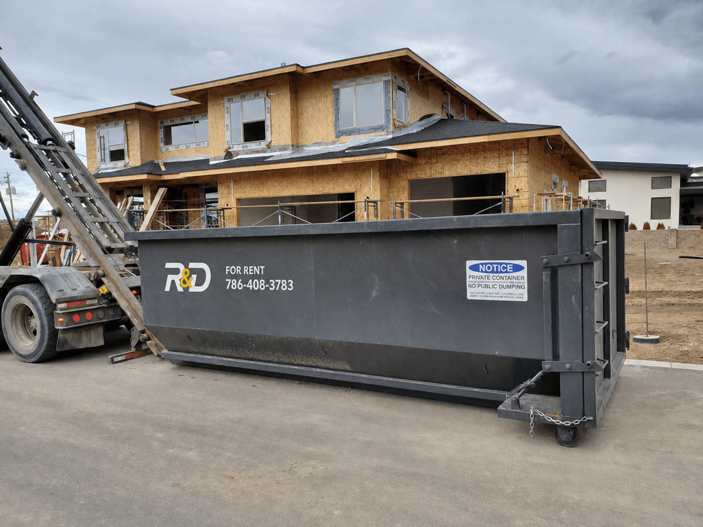 R&D dumpster on commercial job site